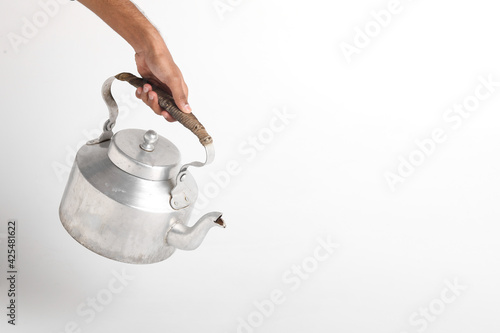 Aluminum tea kettle or tea pot on white background. photo