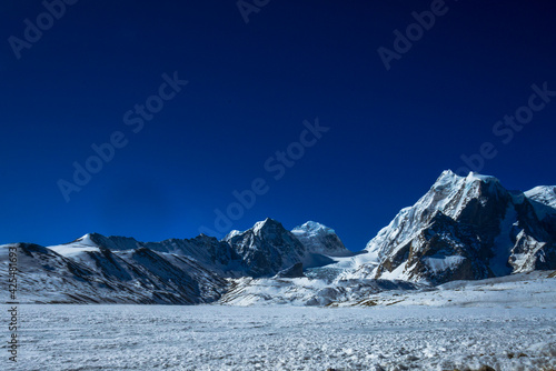 Snowy mountain landscape. Mountain landscape. Scenic Gurudogmar Lake is one of the highest lakes in the world in Sikkim, India, located at an altitude of 5,430 m.
