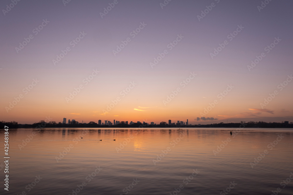 Sunset over lake Kralingse Plas in Rotterdam, the Netherlands, as seen from the promenade on the eastern shore