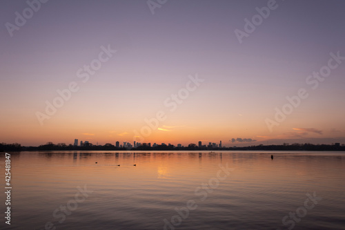 Sunset over lake Kralingse Plas in Rotterdam, the Netherlands, as seen from the promenade on the eastern shore © Tjeerd
