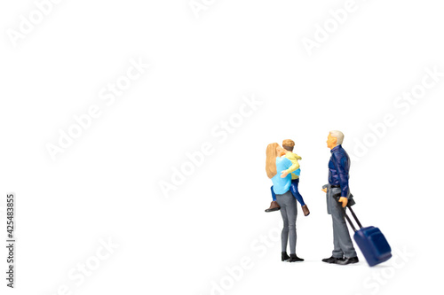 Miniature people Happy family standing on white background
