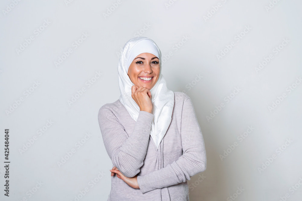 Beautiful muslim woman posing and smiling. Portrait of a beautiful muslim woman wearing hijab. Beautiful young Muslim woman wearing a hijab on her head Beautiful muslim woman posing and smiling. Portrait of a beautiful muslim woman wearing hijab. Beautiful young Muslim woman wearing a hijab on her head