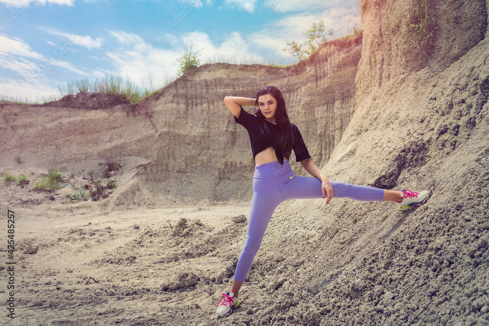 female model in casual cloth walk in sand quarry female model in casual cloth walk in sand quarry