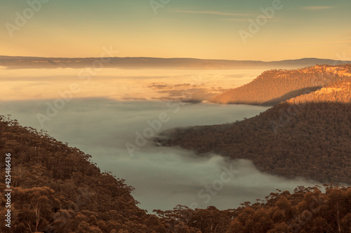 Fog in the Megalong Valley in The Blue Mountains in Australia photo