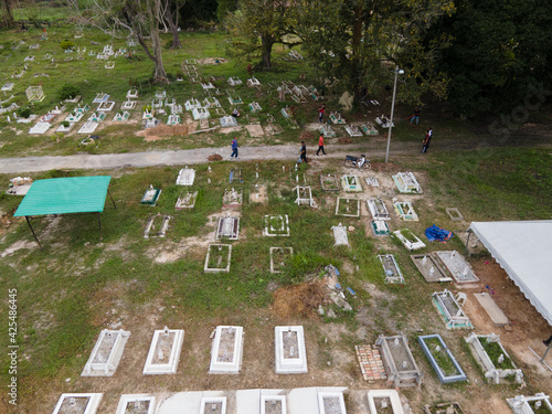 Aerial view of a Muslim cemetery compound in Malaysia. Generally the graves do not arranged systematically but the janazah's head will always face the kiblah. Selective focus points