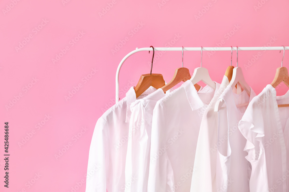Rack with modern clothes in room - obrazy, fototapety, plakaty 