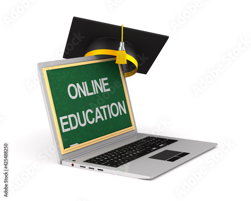 laptop and graduation cap o...