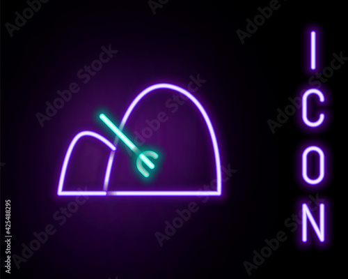 Glowing neon line Bale of hay and rake icon isolated on black background. Colorful outline concept. Vector