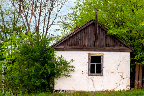 Old wooden clay house in an abandoned village © rostovdriver
