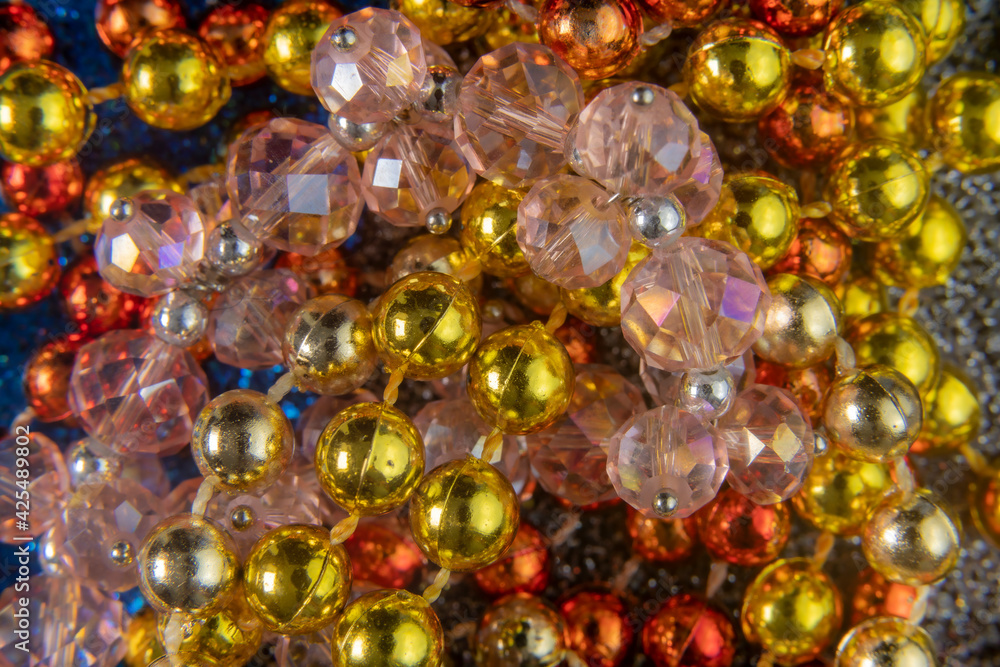 Close up of bright colorful beads necklaces. Macro holiday background Close up of bright colorful beads necklaces. Macro holiday background