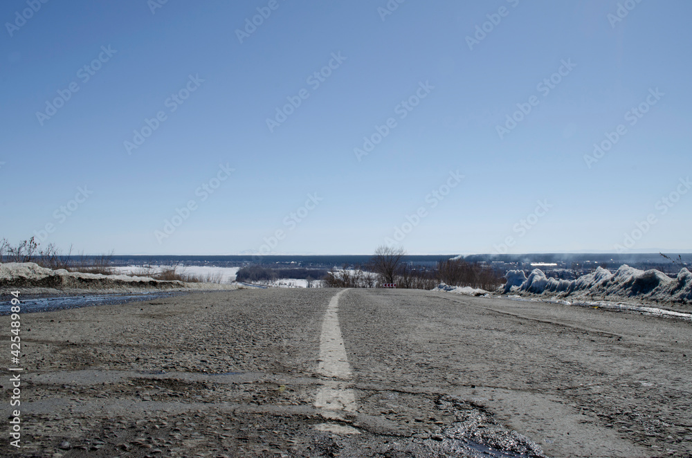 old asphalt road against the sky