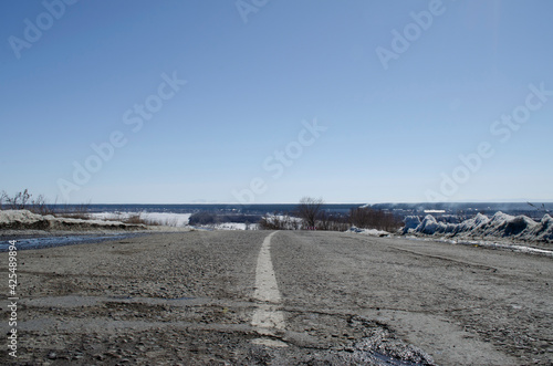 old asphalt road against the sky