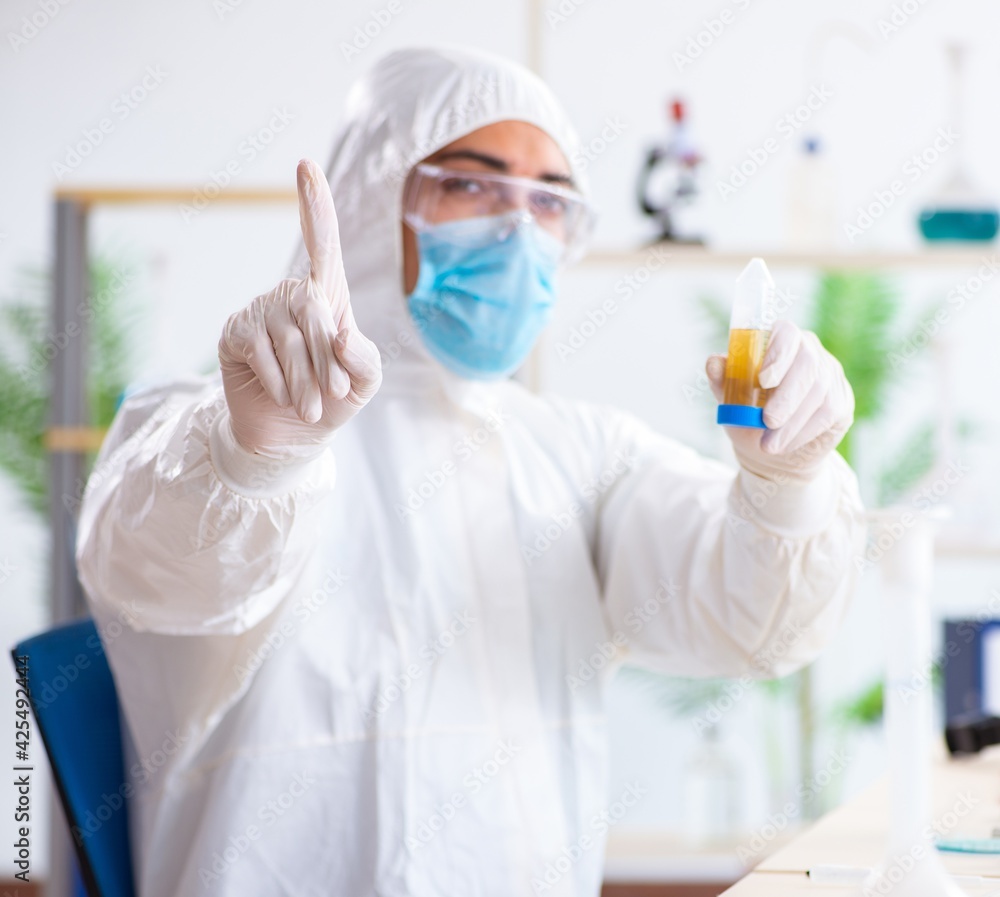Young chemist student working in lab on chemicals Young chemist student working in lab on chemicals