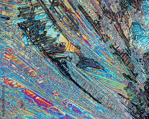 Colorful microscopic view of Epsom Salt or Magnesium Sulfate heptahydrate Crystals. Abstract background texture.  captured under polarized light with a microscope. photo