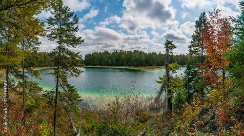 The crystal clear McGinnis Lake with its distinct green and blue colors in Petroglyphs Provincial Park located in Ontario, Canada. photo