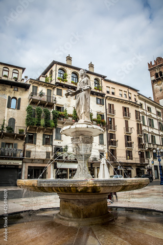 The famous square of Herbs (Piazza delle Erbe) with the fountain of the Madonna of Verona. Verona, Veneto, Italy