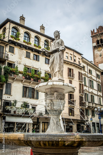The famous square of Herbs (Piazza delle Erbe) with the fountain of the Madonna of Verona. Verona, Veneto, Italy