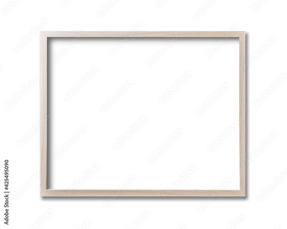 Wooden picture frame hanging on a white wall Wooden picture frame hanging on a white wall
