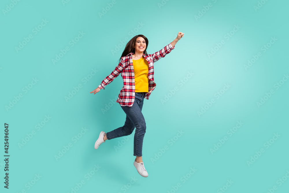 Full length body size view of pretty cheerful girl jumping striving accomplish isolated over bright teal turquoise color background