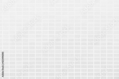 White tiles wall background. Building exterior decoration.