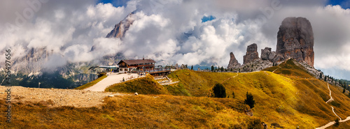 Wonderful mountain panorama Dolomites alps. Amazing nature landscape. View on Cinque Torri, Rifugio Scoiattoli and Tofana Rozes in clouds. Popular travel and hiking destination. Amazing Nature Scenery