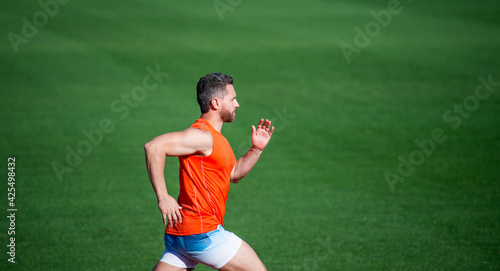 athletic man compete in sprint. sport healthy lifestyle. fitness training outdoor. runner run fast on running track. energetic and sporty. marathon speed energy. muscular man in motion © be free