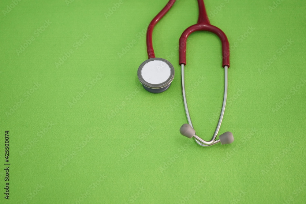 stethoscope on green background stethoscope on green background