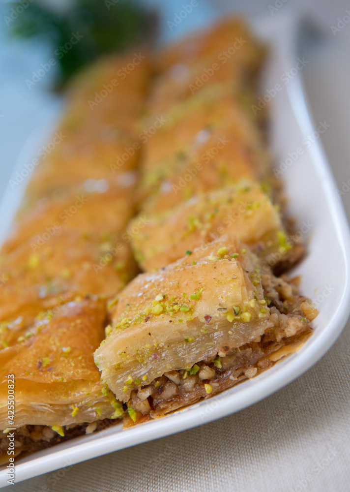 Baklawa on a plate on a table, top view, baklava, feast treat ramadan traditional dessert, High quality photo Baklawa on a plate on a table, top view, baklava, feast treat ramadan traditional dessert, High quality photo