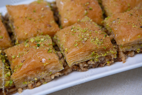 Baklawa on a plate on a table, top view, baklava, feast treat ramadan traditional dessert, High quality photo