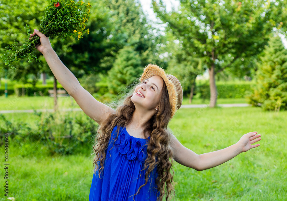 Optimistic smiling girl enjoying sunny summer day in nature, carefree mood Optimistic smiling girl enjoying sunny summer day in nature, carefree mood