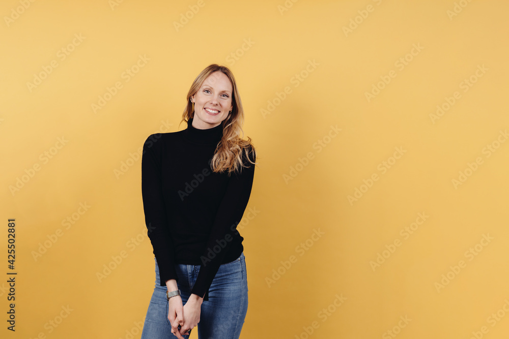 Cute vivacious young woman with long blond hair Cute vivacious young woman with long blond hair