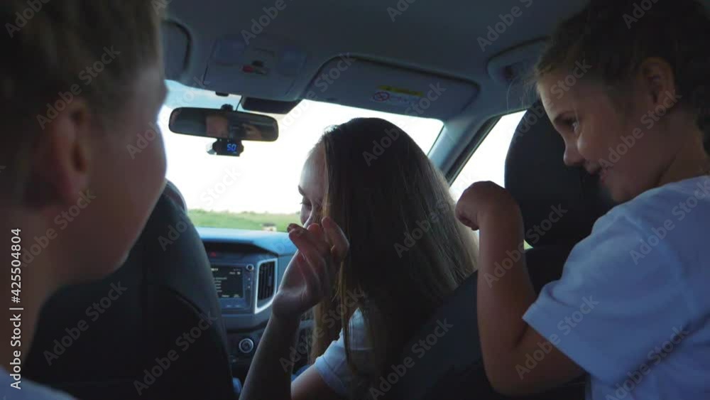 Family travel by car. A happy family has a fun summer vacation with their children. Road safety. Life insurance. Family travel by car. A happy family has a fun summer vacation with their children. Road safety. Life insurance.