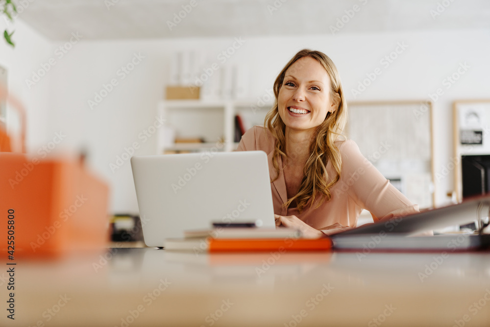 Happy sincere young businesswoman with a warm friendly smile Happy sincere young businesswoman with a warm friendly smile
