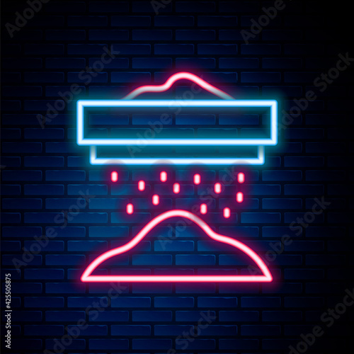 Glowing neon line Sifting flour, cereals or powdered sugar through sieve icon isolated on brick wall background. Colorful outline concept. Vector