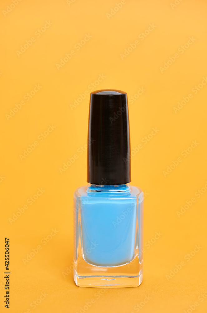 Cyan paint pot on yellow background Cyan paint pot on yellow background
