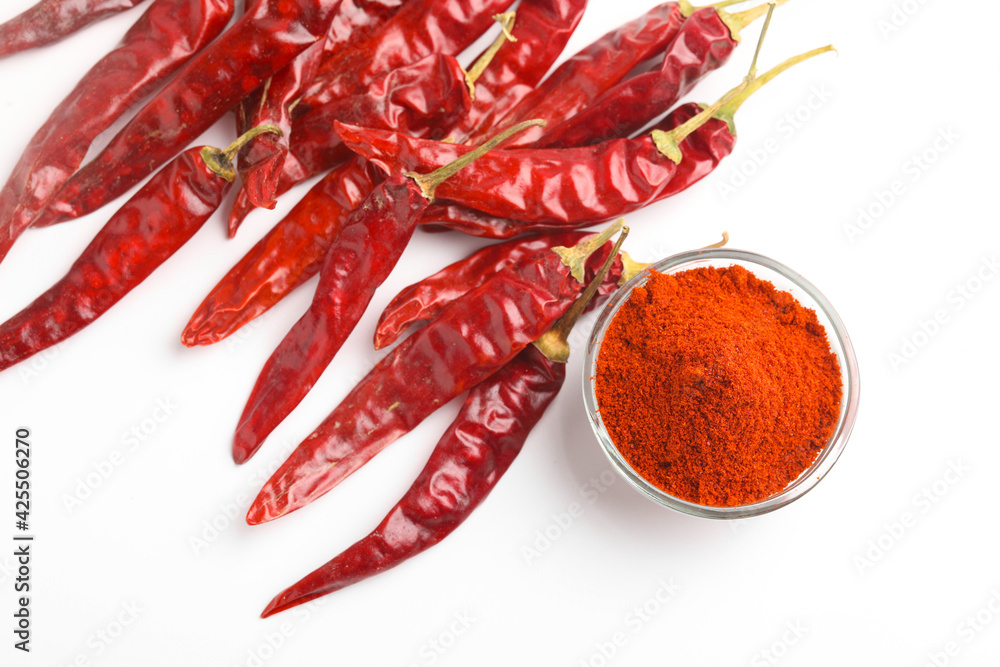 Dried red chilli and powder in glass bowl on white background. Dried red chilli and powder in glass bowl on white background.
