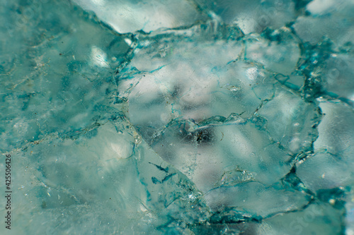 Macro photograph of light blue mineral crystal structure, extreme close-up of geological rock formation with translucent crystalline textures