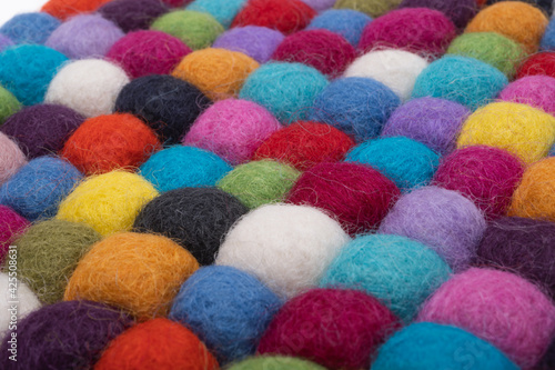 colored balls made of felt close-up