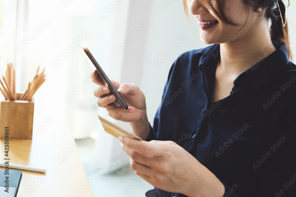 Online payment, Young Women's hands holding smprtphoene and credit card for online shopping. Online payment, Young Women's hands holding smprtphoene and credit card for online shopping.