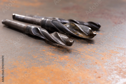 Set of drills on a rusty background