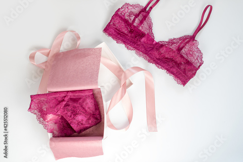 Shopping and fashion, female wardrobe concept. Set of glamorous stylish sexy lace lingerie in pink giftbox on white background. Woman accessories.