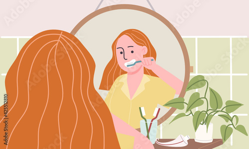 Flat style vector illustration of cartoon woman character in yellow pajamas standing in front of mirror and brushing teeth in bathroom. Morning and night routine. Mouth, Oral, Dental caring at home.