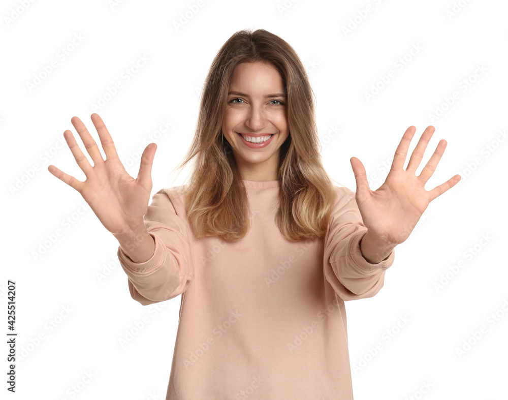Woman showing number ten with her hands on white background Woman showing number ten with her hands on white background
