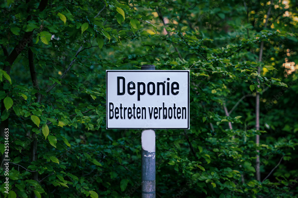 Sign: Deponie Betreten verboten (German for: Landfill, do not enter), seen the Quellenhang am Lintorfer Mark forest in Ratingen, North Rhine-Westphalia, Germany