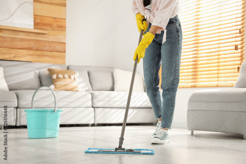 Woman cleaning floor with mop at home, closeup - obrazy, fototapety, plakaty 