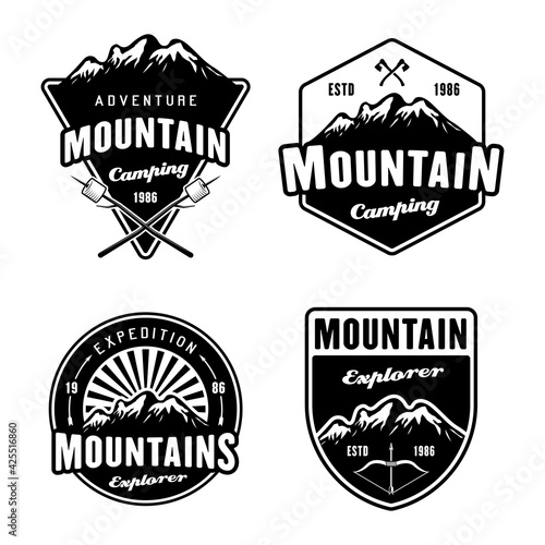 Mountains and outdoor adventure, camping and hiking set of four black vector emblems, labels, badges or logos isolated on white background