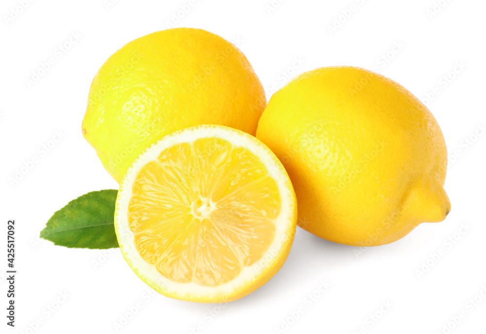 Cut and whole ripe lemons with green leaf isolated on white