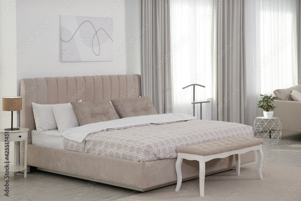 Stylish hotel bedroom interior with modern furniture Stylish hotel bedroom interior with modern furniture