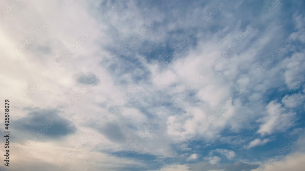 White Clouds motion on blue sky background. Time Lapse 4k, clean, no birds. Summer spring season concept