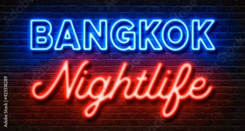 Neon sign on a brick wall - Bangkok Nightlife